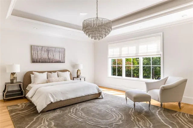 a bedroom with a bed and a chair