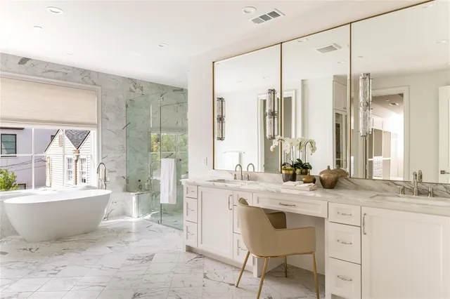 a bathroom with a tub sink and mirror