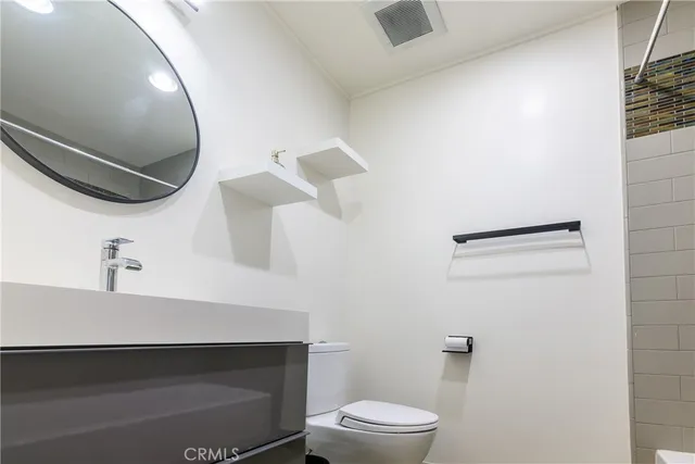 a bathroom with a sink and mirror
