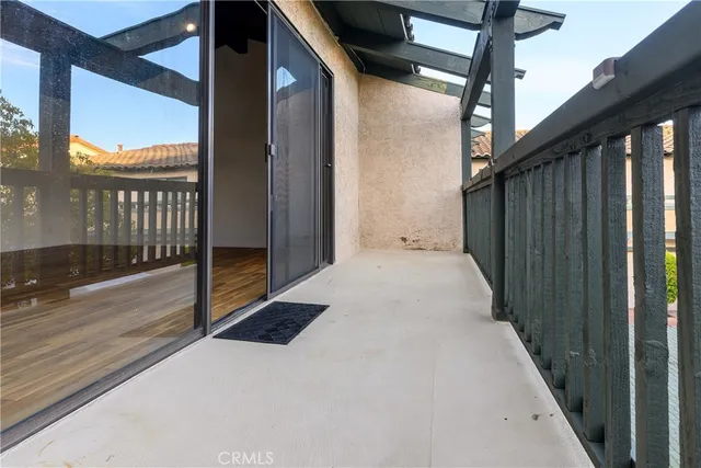 a balcony with view of outdoor space