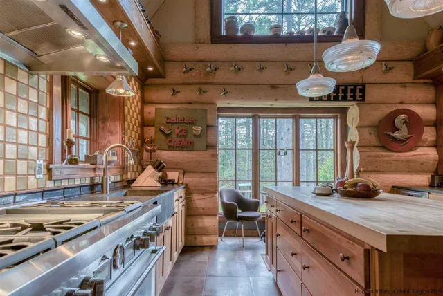 a kitchen with sink stove and cabinets