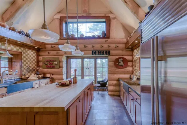 a view of a room with workspace and windows