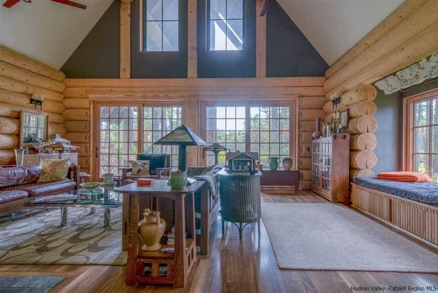 a view of a patio with couches table and chairs and potted plants