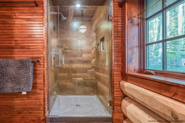 a backyard of a house with a yard basket ball court and outdoor seating