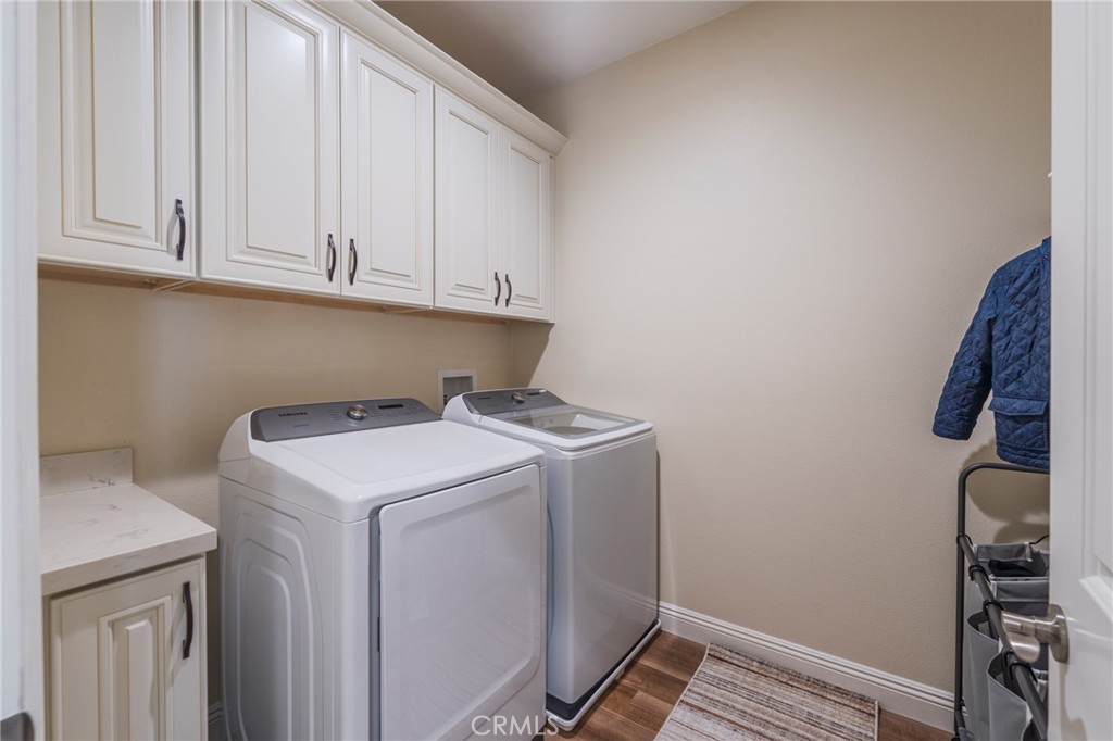 14944 Texaco Avenue Paramount, CA 90723 - Photo 20 of 25 Dedicated upstairs laundry with extra storage cabinets.