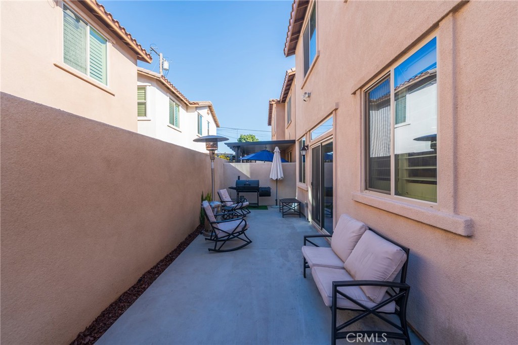 14944 Texaco Avenue Paramount, CA 90723 - Photo 21 of 25 Low-maintenance backyard with concrete finish, ideal for gatherings or relaxing.