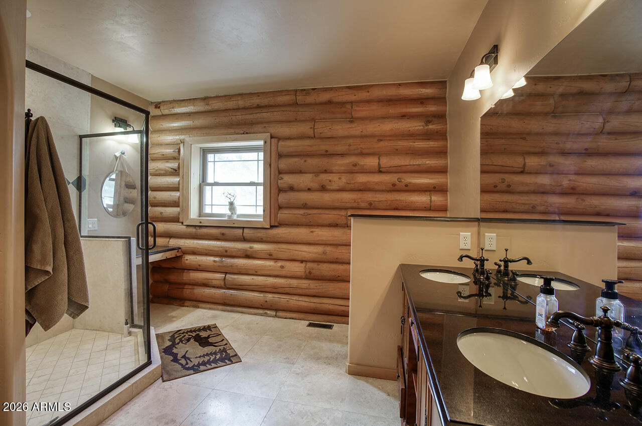 13090 Ghost Train Trail Parks, AZ 86046 - Photo 11 of 23 a bathroom with a sink a toilet and mirror