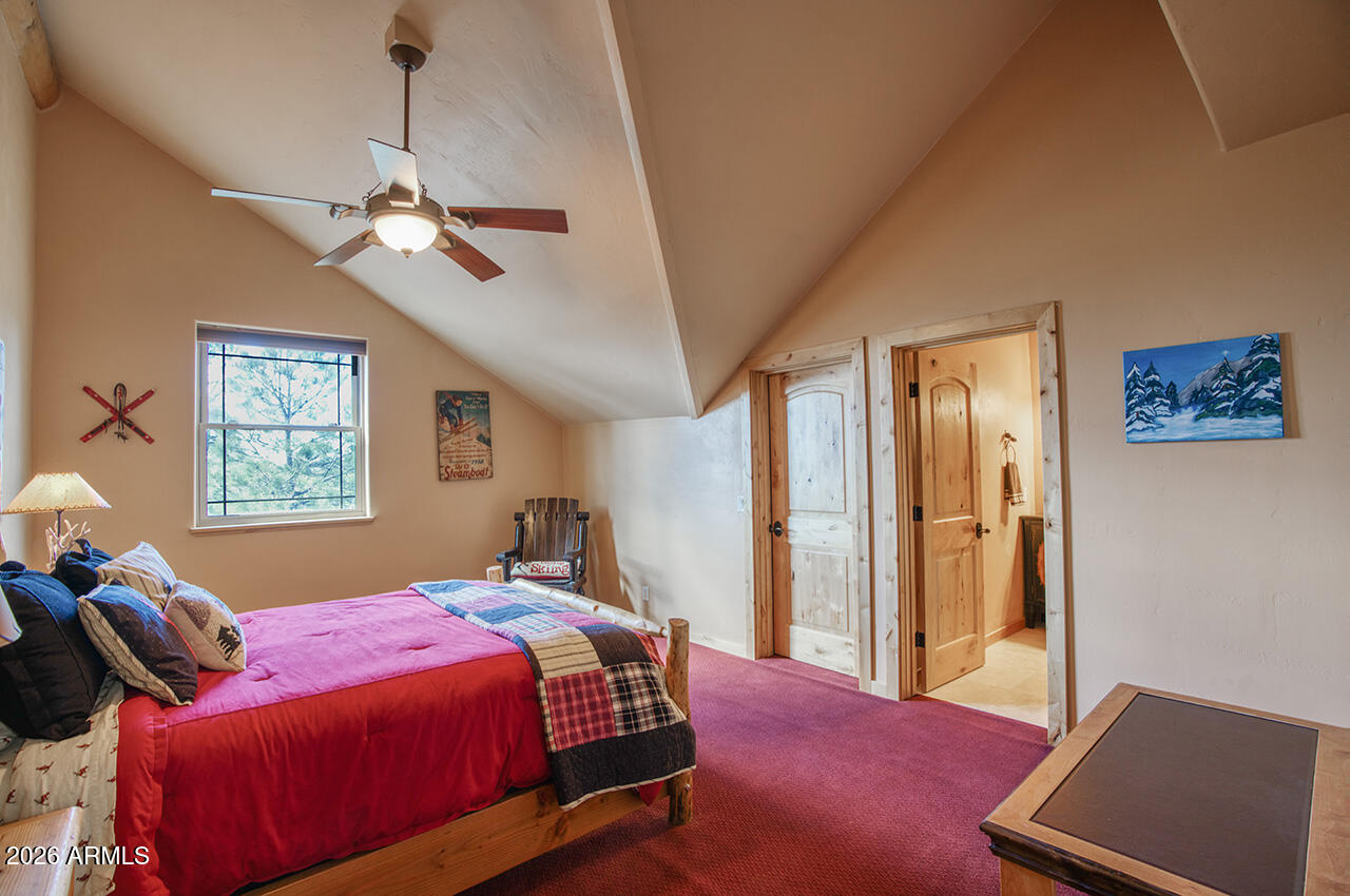 13090 Ghost Train Trail Parks, AZ 86046 - Photo 14 of 23 a bedroom with a bed and a window
