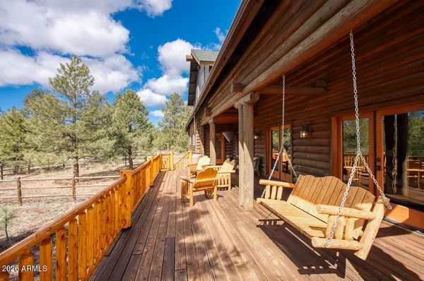 a view of balcony with furniture