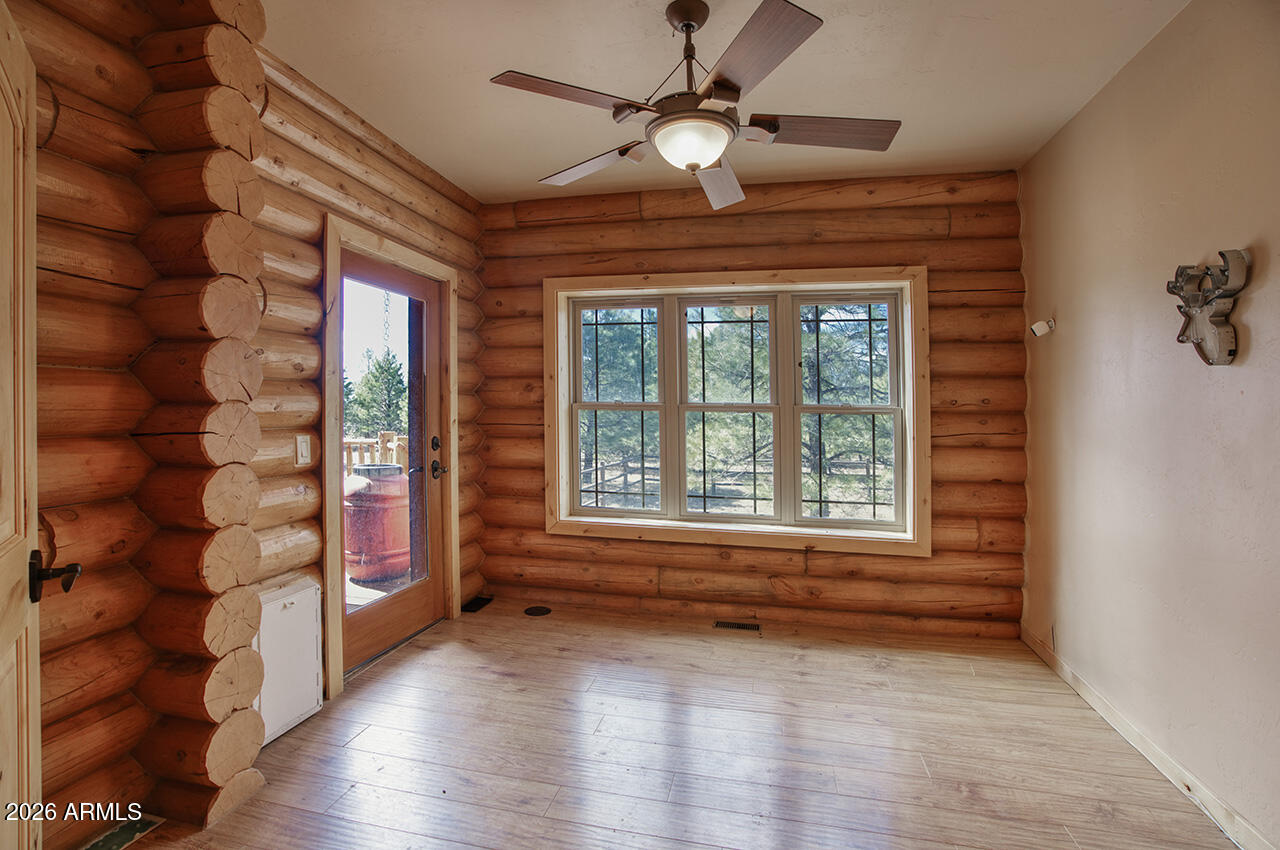 13090 Ghost Train Trail Parks, AZ 86046 - Photo 8 of 23 wooden floor in an empty room with a window