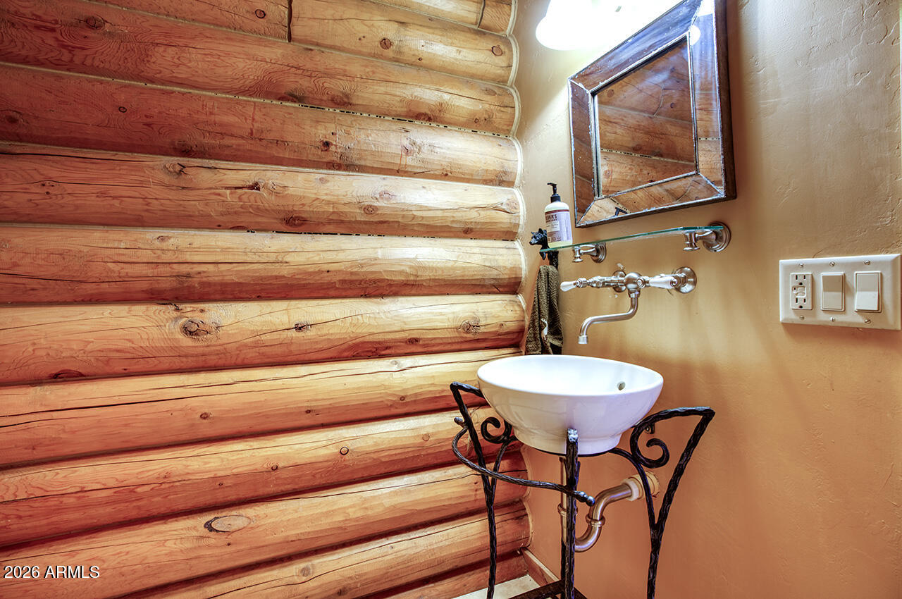 13090 Ghost Train Trail Parks, AZ 86046 - Photo 9 of 23 a bathroom with a table and a mirror