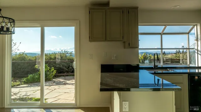 a kitchen with a sink and a window
