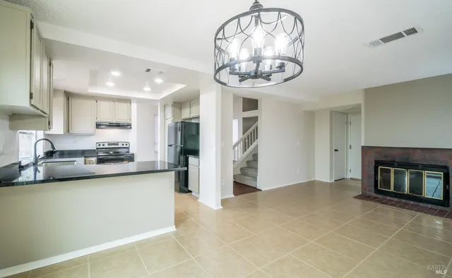 a view of a kitchen and a window