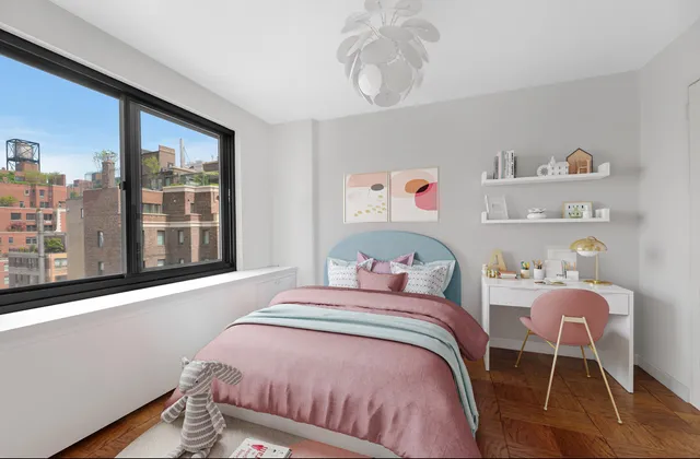 a bedroom with a bed and a large window