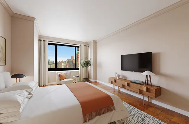 a bedroom with bed and a flat screen tv