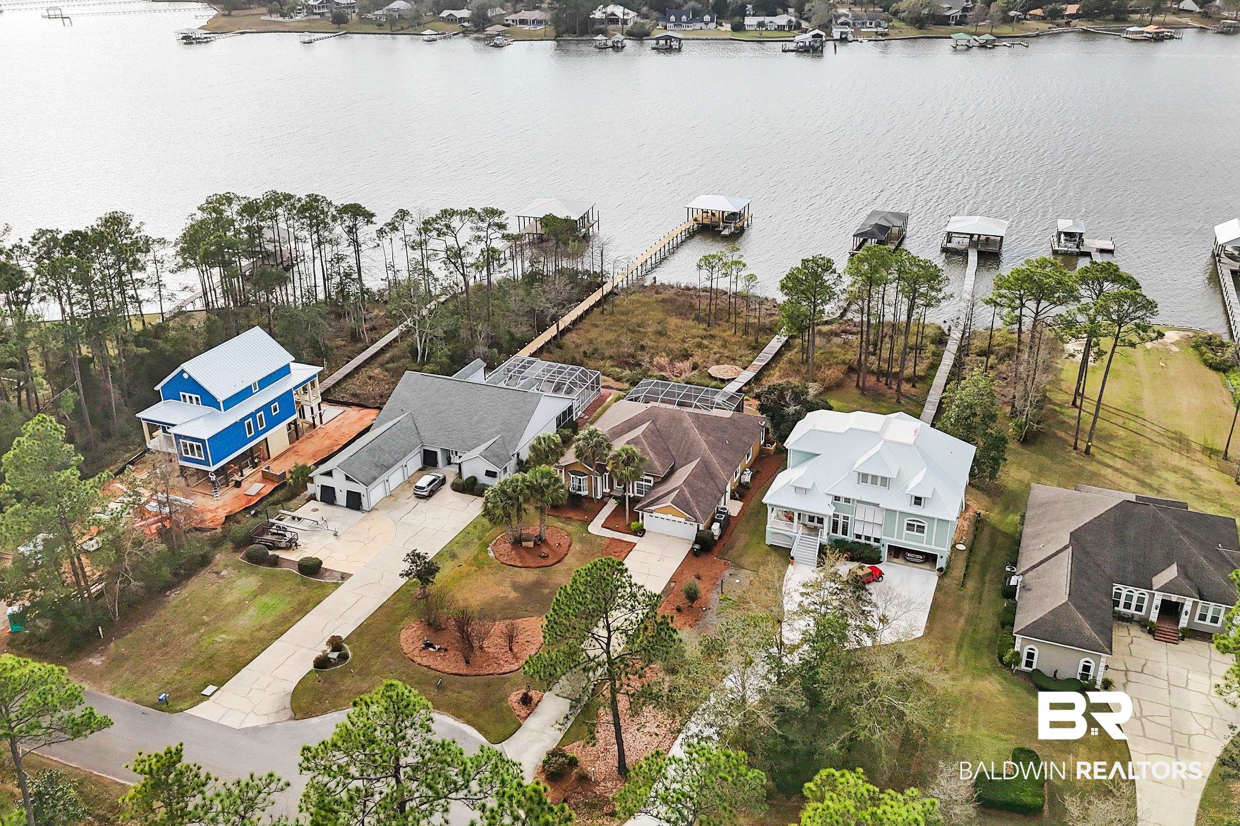 8591 Bay Harbor Road Elberta, AL 36530 - Photo 52 of 56 Aerial view of residential area featuring a nearby body of water