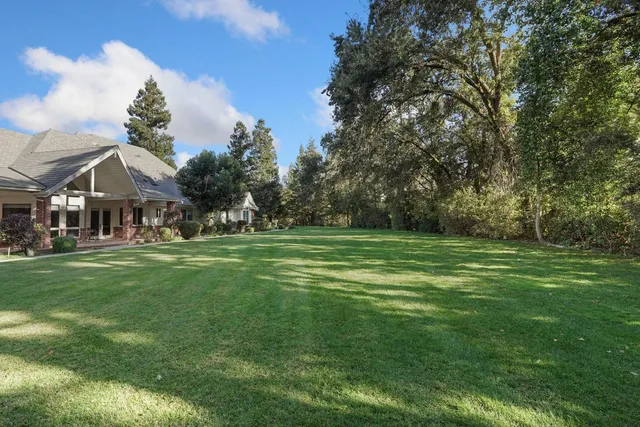 a bathroom with a shower and a glass door