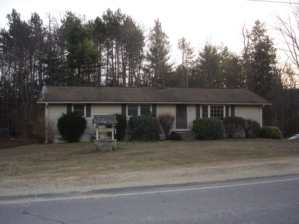 1033 Turnpike Road Ashby, MA 01431 - Photo 11 of 12 a front view of a house with a yard