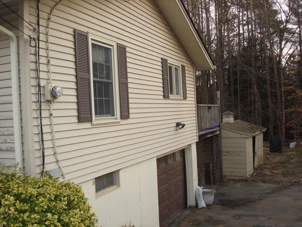 1033 Turnpike Road Ashby, MA 01431 - Photo 12 of 12 a view of a house with a yard and potted plants
