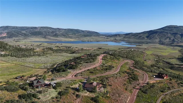 a view of mountains in middle of the road