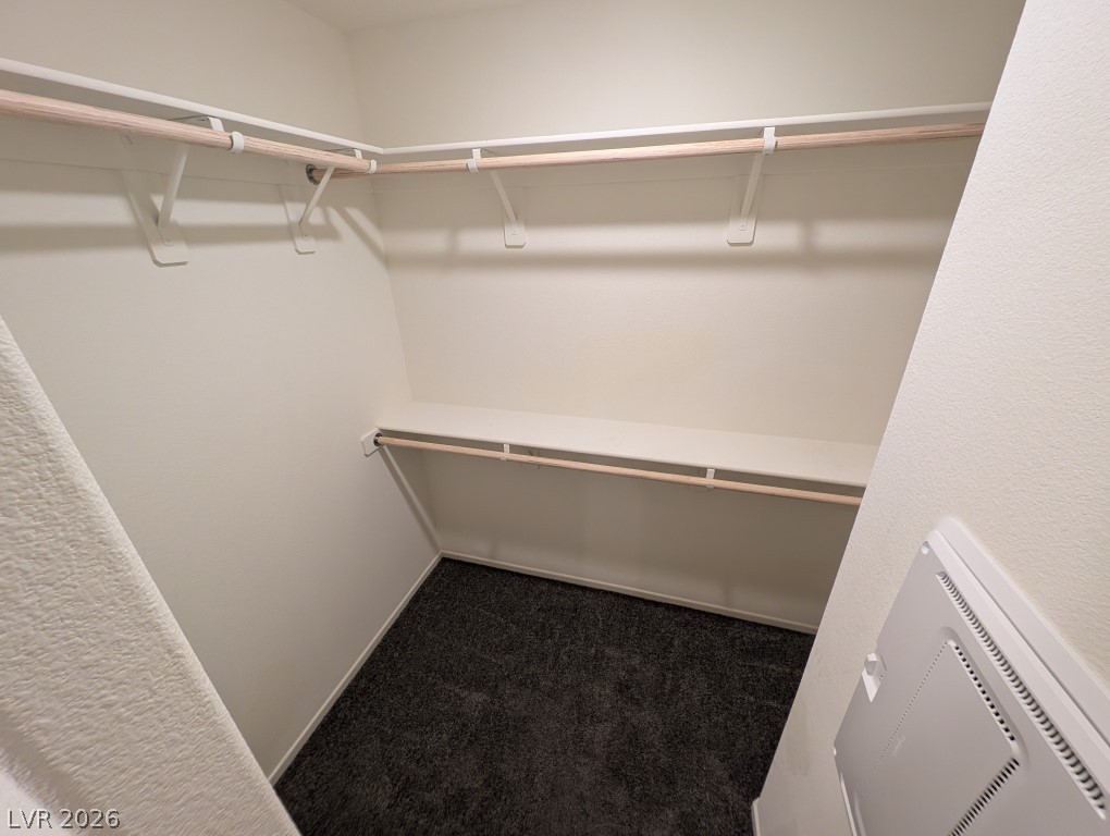 4820 Orchid Rdg Avenue Las Vegas, NV 89141 - Photo 20 of 27 Ample closet space awaits with convenient shelving and hanging rods for organized storage.