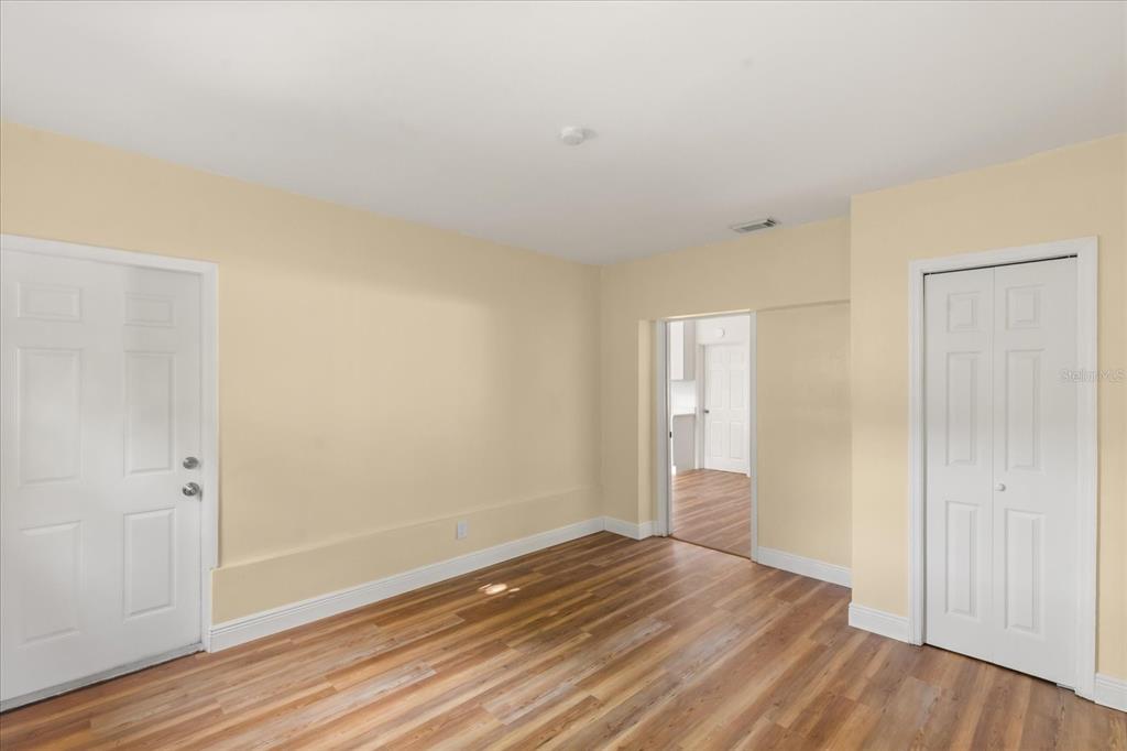 12432 136th Lane Largo, FL 33774 - Photo 16 of 24 a view of an empty room and wooden floor