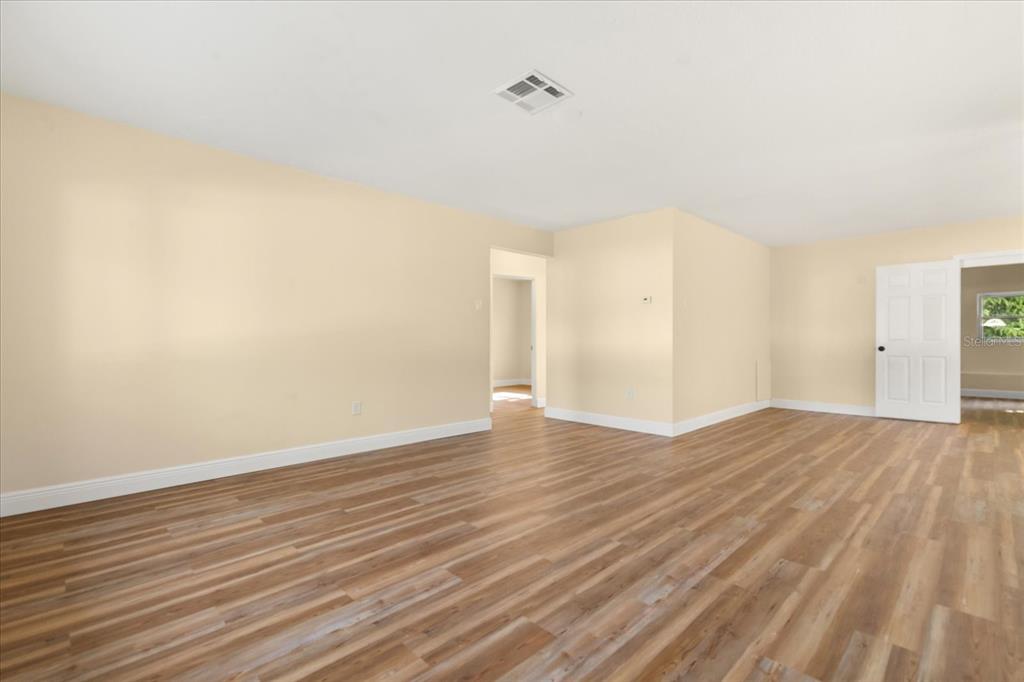 12432 136th Lane Largo, FL 33774 - Photo 4 of 24 wooden floor in an empty room