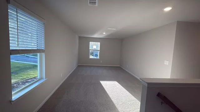 a view of an empty room and window