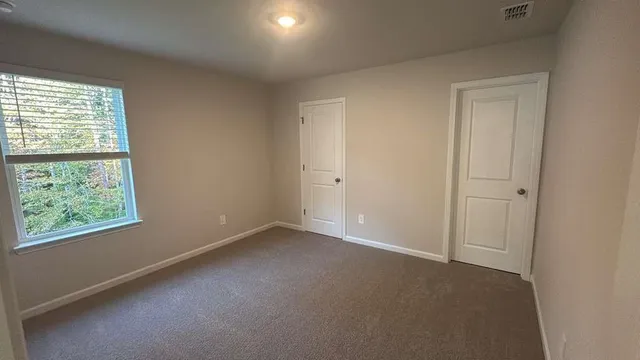 an empty room with windows