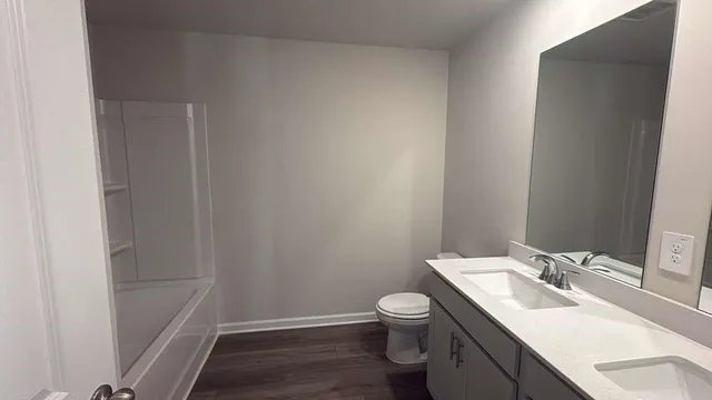 a bathroom with a sink toilet and vanity