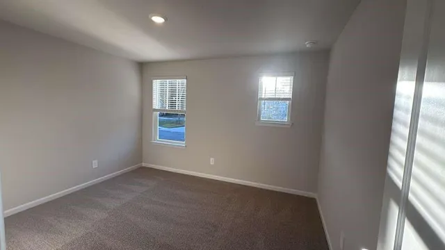 an empty room with windows