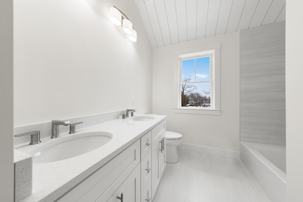 2 Old County Road, Unit 10 Salisbury, MA 01952 - Photo 10 of 27 a bathroom with a sink a toilet and shower