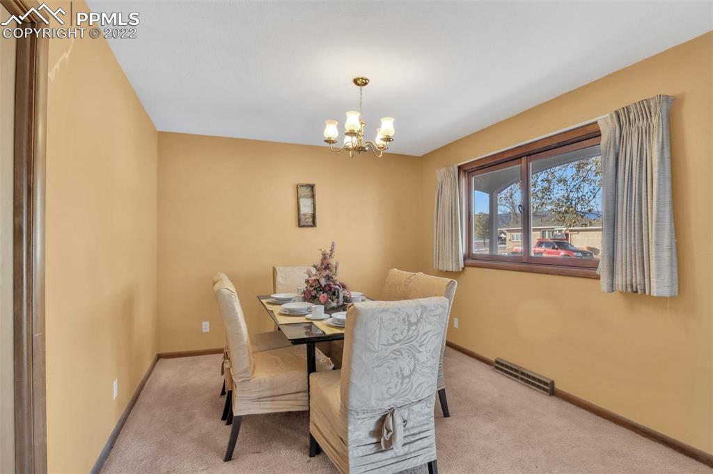 104 Dewey Road Canon City, CO 81212 - Photo 5 of 12 a dining room with furniture and window