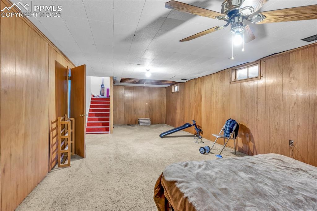 104 Dewey Road Canon City, CO 81212 - Photo 7 of 12 a bedroom with bed and ceiling fan