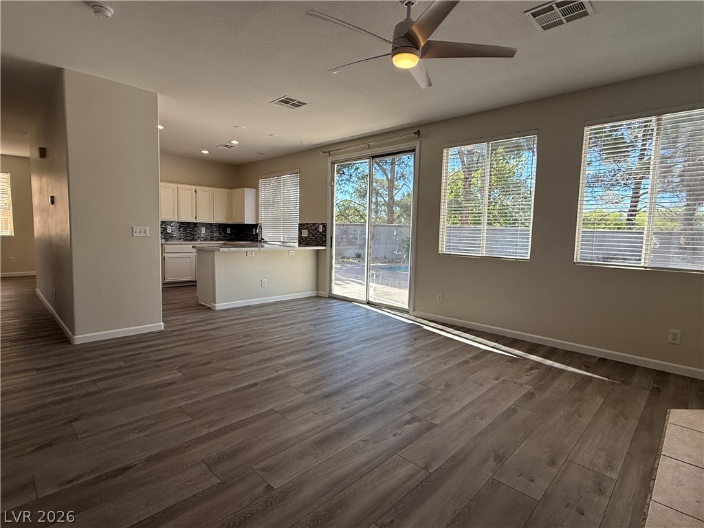 1908 Thunder Ridge Circle Henderson, NV 89012 - Photo 28 of 28 An open floorplan seamlessly connects a generous living space to the kitchen and an inviting outdoor pool.