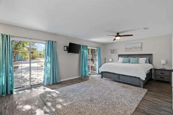 a bedroom with a large bed and a window