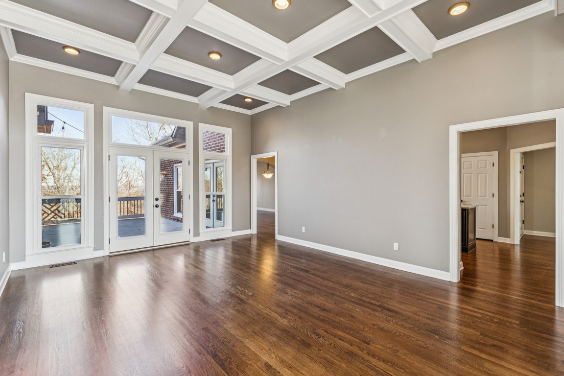 230 Temple Crest Trail Franklin, TN 37069 - Photo 12 of 40 a view of an empty room with wooden floor and a window