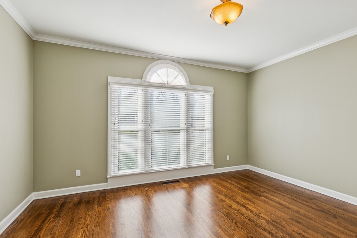 230 Temple Crest Trail Franklin, TN 37069 - Photo 17 of 40 a view of an empty room with wooden floor and a window