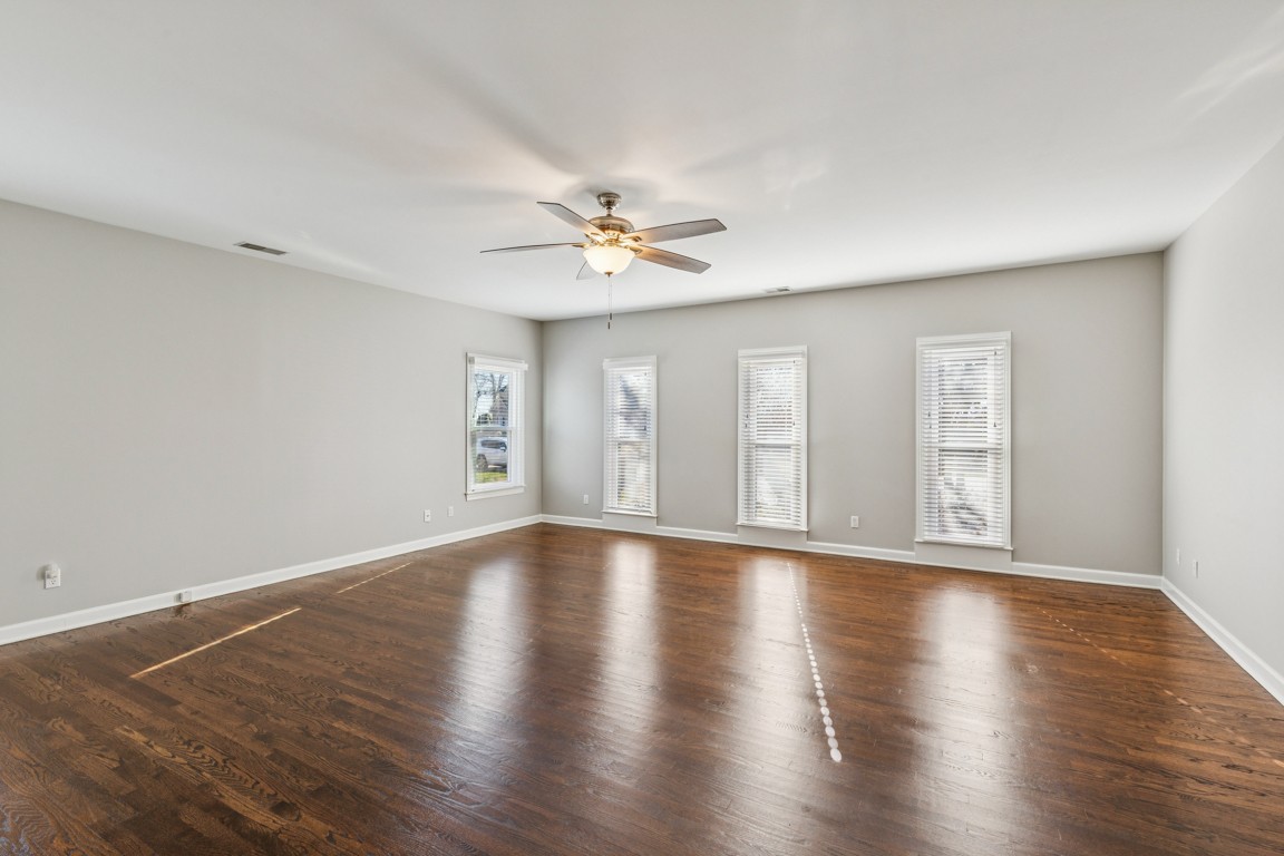 230 Temple Crest Trail Franklin, TN 37069 - Photo 24 of 40 a view of an empty room with window and wooden floor
