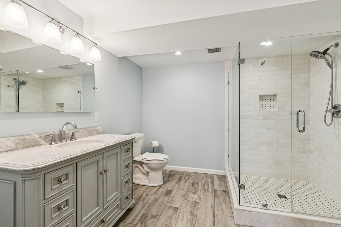230 Temple Crest Trail Franklin, TN 37069 - Photo 33 of 40 a bathroom with a sink a toilet and shower