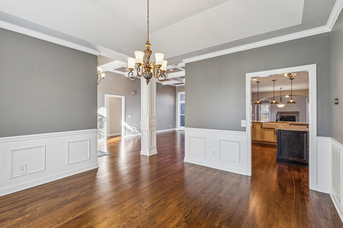 230 Temple Crest Trail Franklin, TN 37069 - Photo 4 of 40 a open kitchen with white cabinets and chandelier
