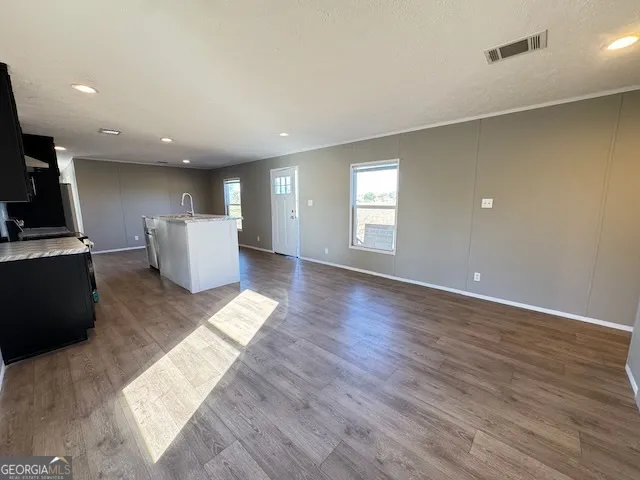 a view of kitchen with windows and furniture