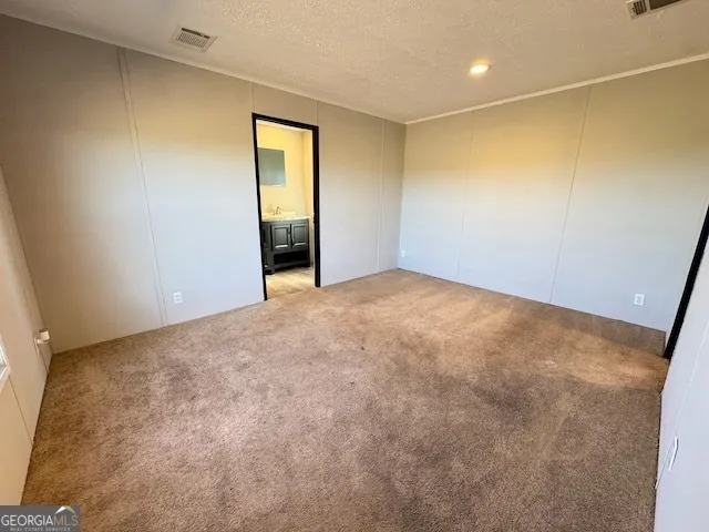 an empty room with a bathroom