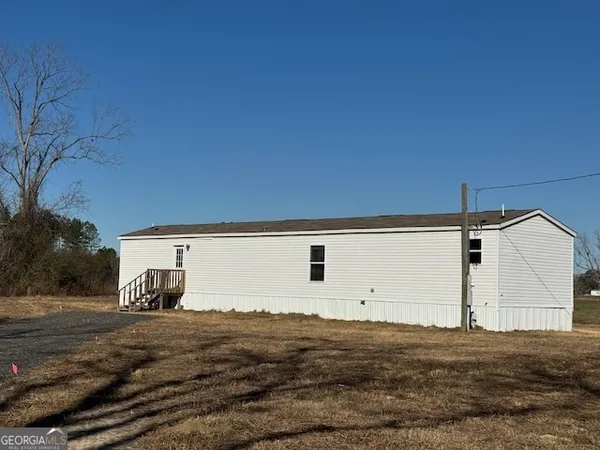 a view of a back yard of the house