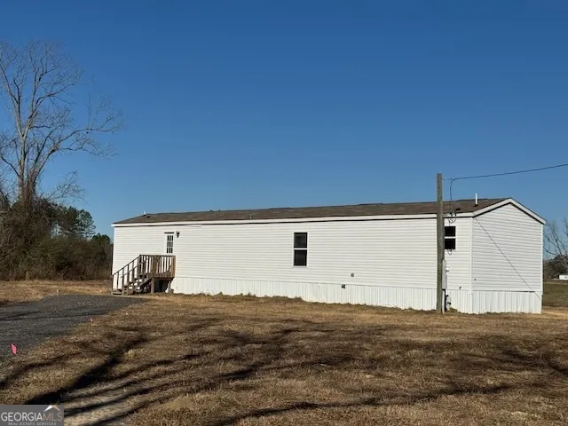 a view of a back yard of the house