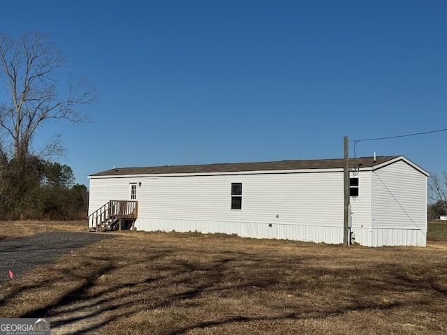 805 Smart Road Alma, GA 31510 - Photo 40 of 41 a view of a back yard of the house