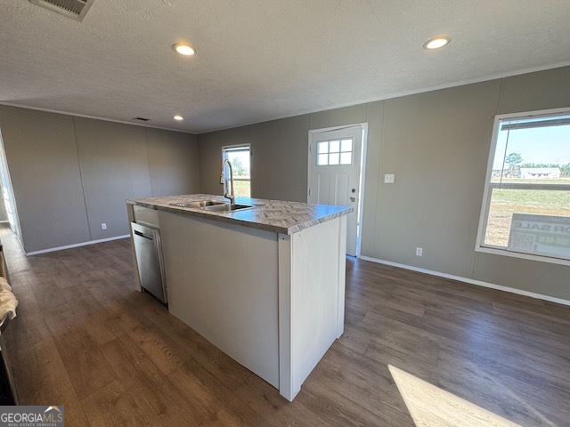 805 Smart Road Alma, GA 31510 - Photo 7 of 41 a kitchen with kitchen island granite countertop a sink and wooden floors