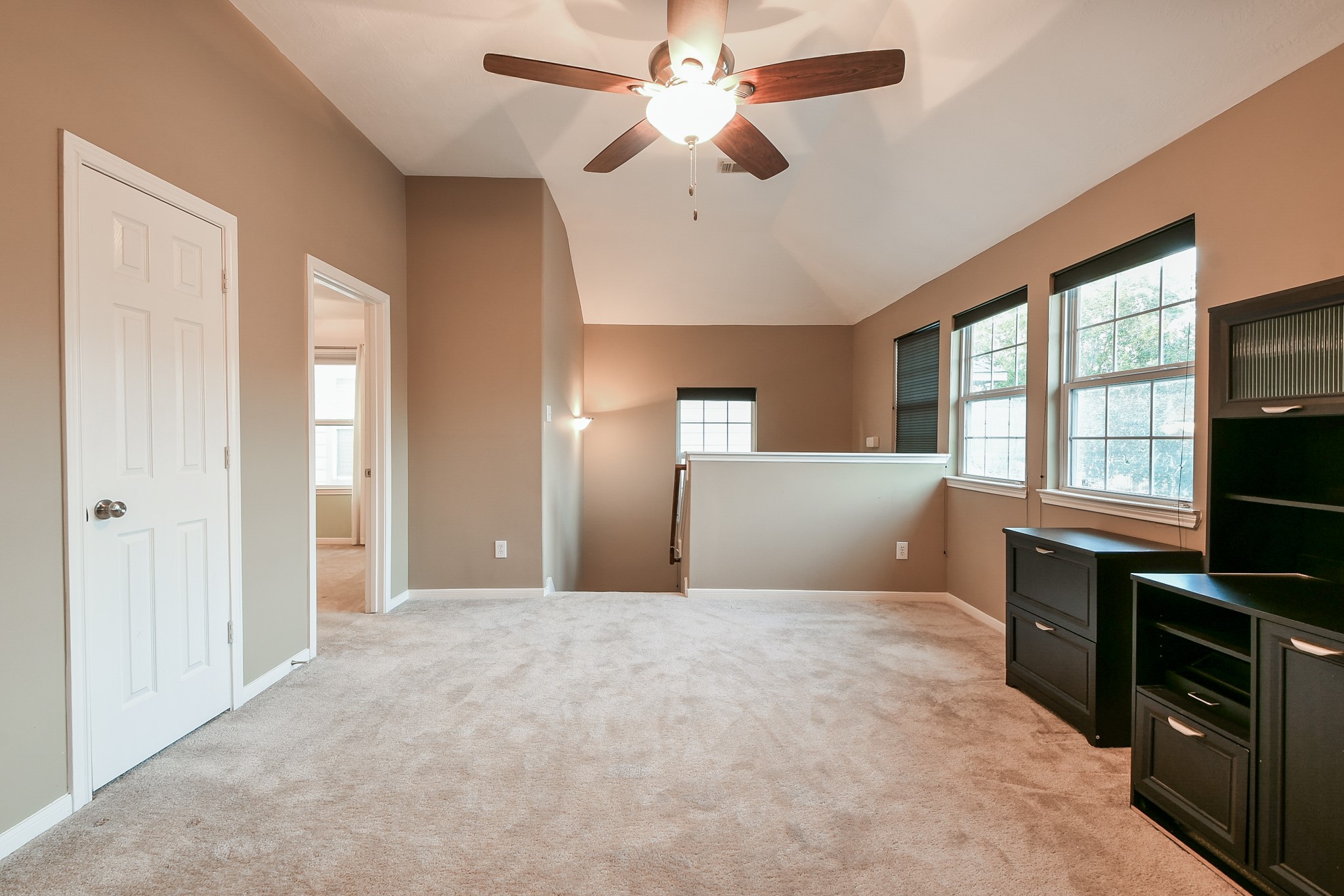 2415 Lacyberry Street Houston, TX 77080 - Photo 18 of 36 a bedroom with a bed and a flat screen tv