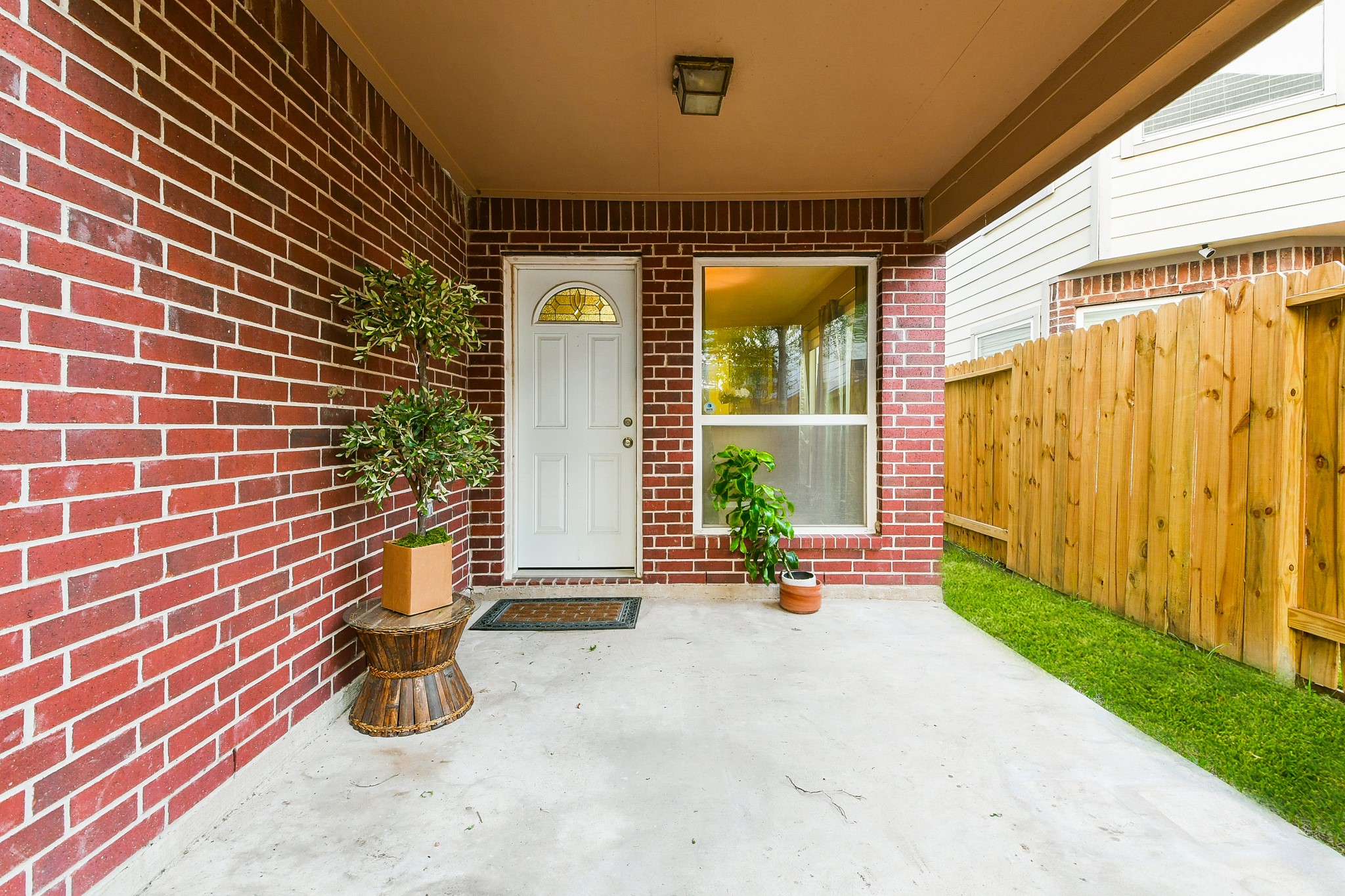 2415 Lacyberry Street Houston, TX 77080 - Photo 35 of 36 a view of a door with a bench and potted plants