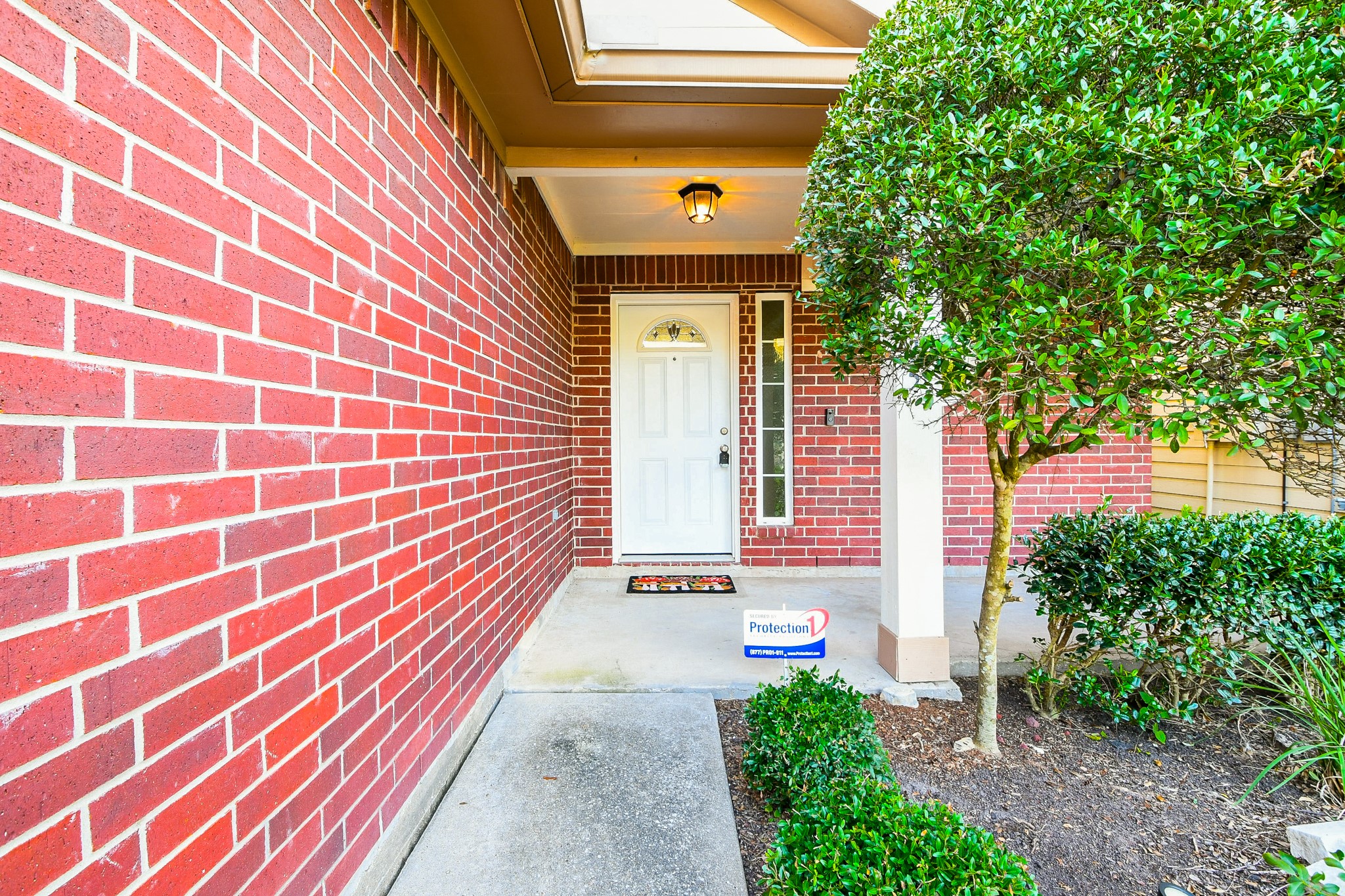 2415 Lacyberry Street Houston, TX 77080 - Photo 4 of 36 a front view of a house with a garden